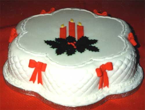 A Christmas cake with quilted icing decoration.